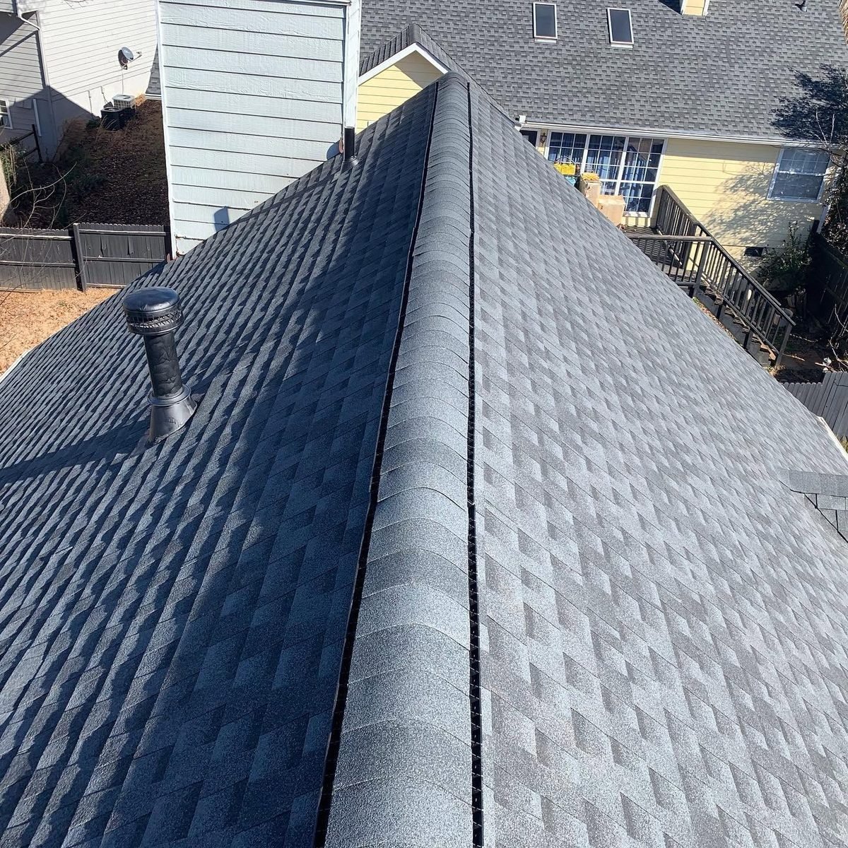Close-up of new architectural shingles and ridge vent